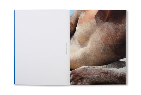 Open photography book "Hola Mi Amol" by SPBH Editions showing black-and-white street photography pages.