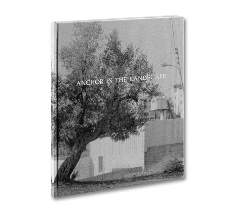 Open photography book "Anchor in the Landscape" by MACK showing a scenic landscape photograph on the page.