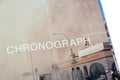Close-up of a SPBH Editions chronograph on a photography book cover, showcasing detailed watch craftsmanship and design.