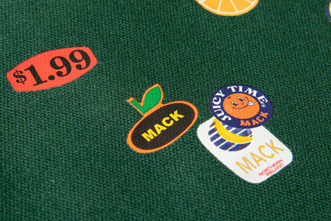 Green tote bag with colorful fruit stickers from MACK featuring a natural fabric handle and playful design.