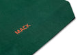 Green tote bag with colorful fruit stickers from MACK, featuring a casual design and sturdy handles.