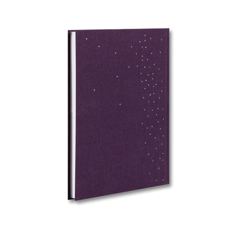 Open book titled "I Saw the Sun" by MACK, showing pages with vibrant sunset photographs inside.